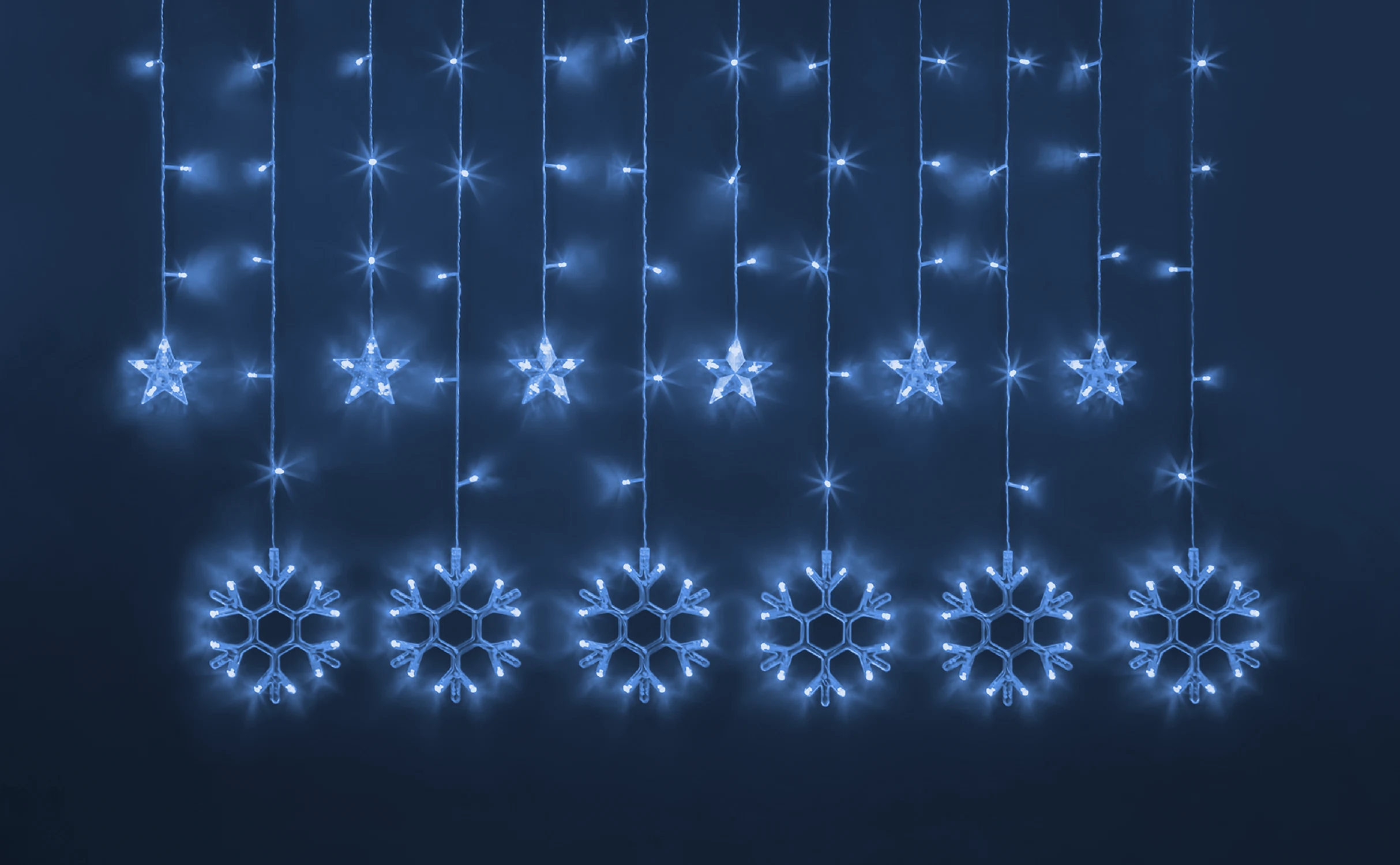 Изображение товара Гирлянда Navigator 95 122 со звездами и снежинками 2 5 м синяя