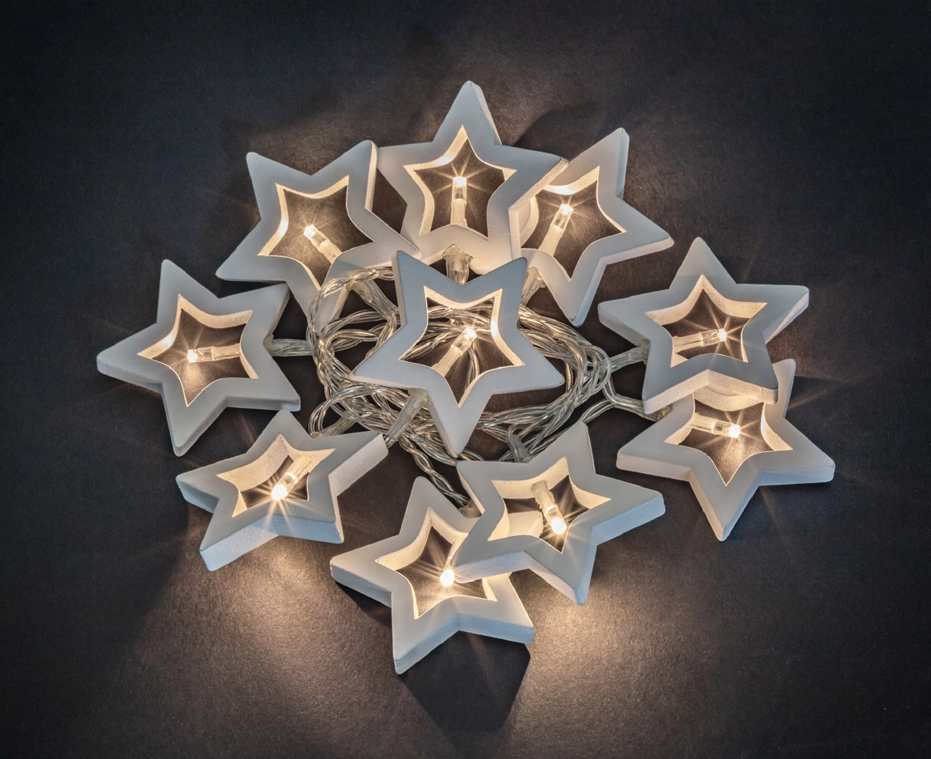 Изображение товара Гирлянда Navigator 14 047, деревянные звездочки, на батарейках, теплый свет, 1.8 м