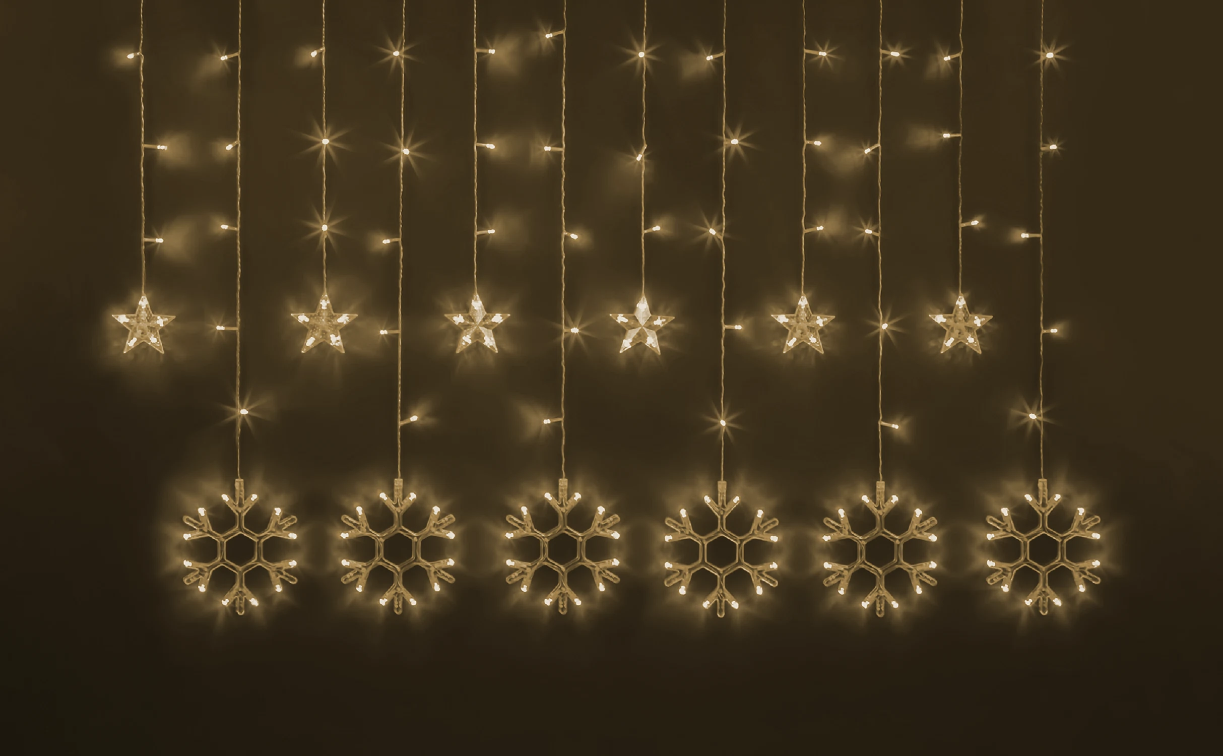 Изображение товара Гирлянда Navigator 95 005 с звездами и снежинками 2,5 м теплый свет