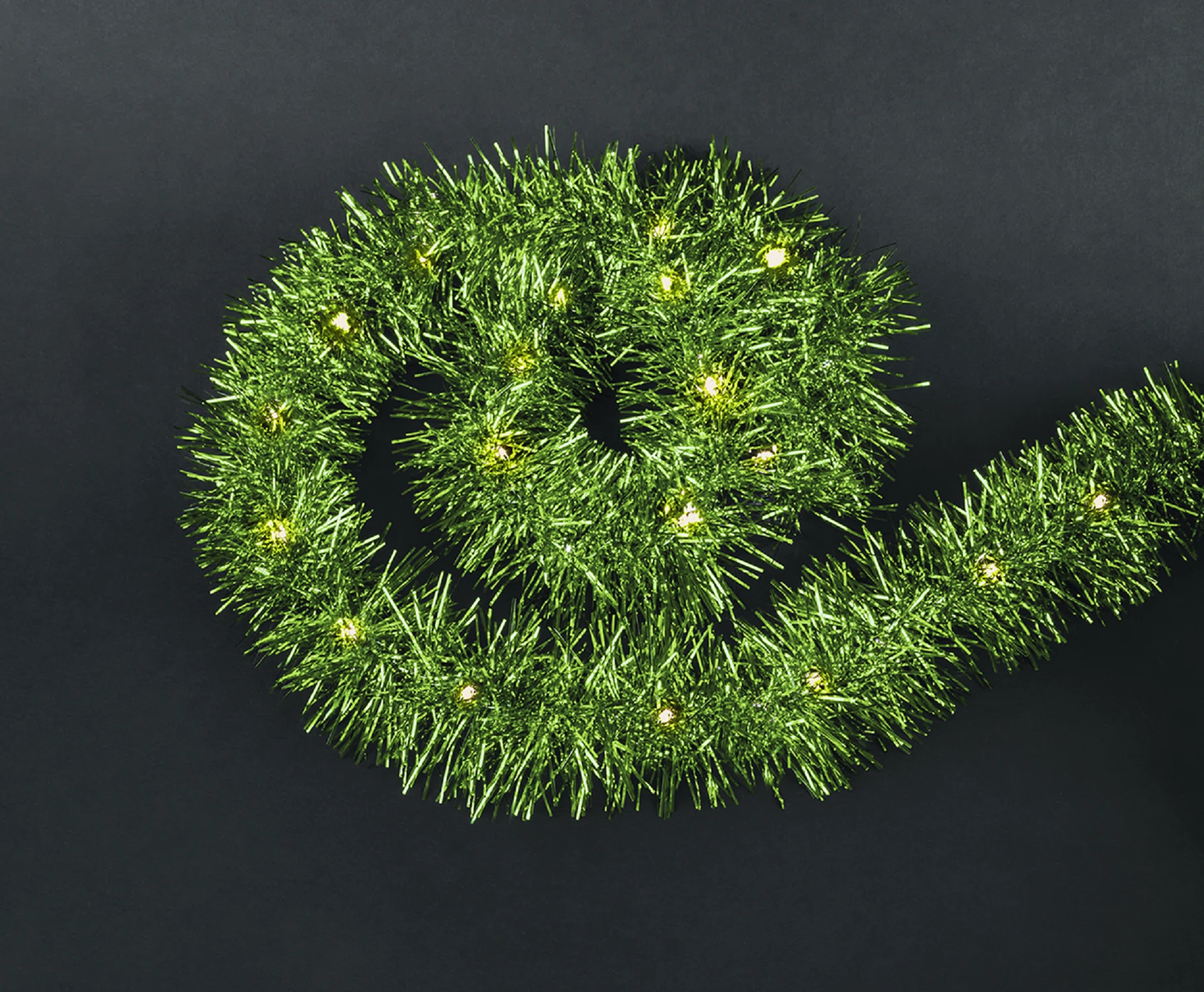 Изображение товара Гирлянда Navigator 95 046 зеленая мишура на батарейках 2 метра теплый свет